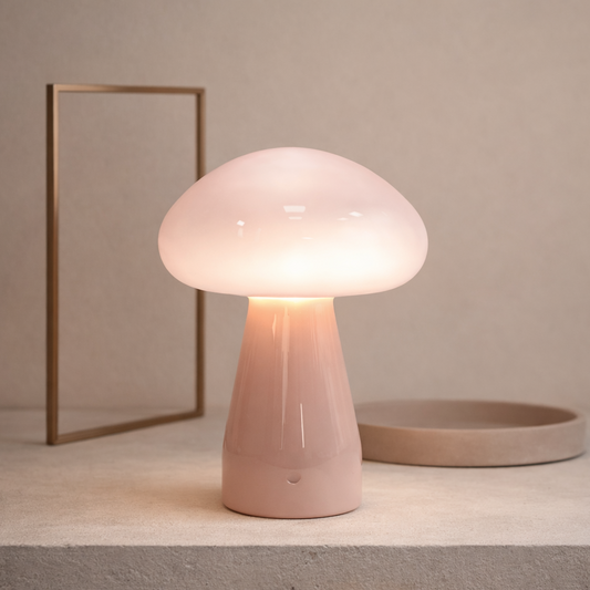 Pink mushroom-shaped table lamp on a neutral background
